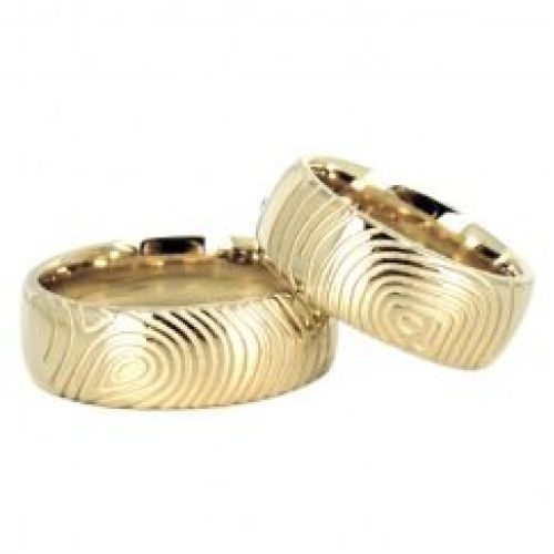 Обручальные кольца из желтого золота с отпечатками пальцев