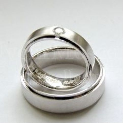 Парные обручальные кольца из белого золота с гравировкой