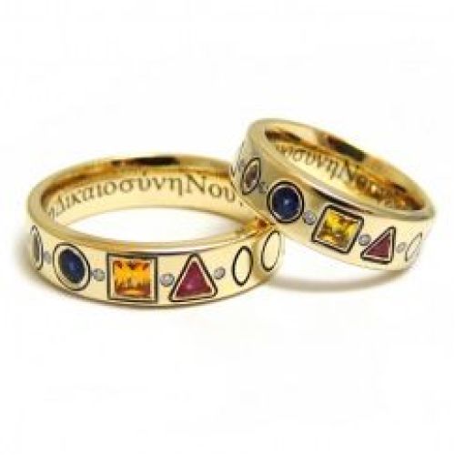 Парные обручальные кольца из желтого золота с разноцветными сапфирами ручной огранки