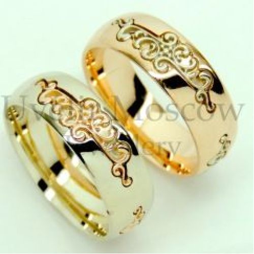 Парные обручальные кольца из комбинированного золота с узором