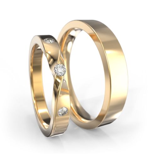 Обручальные кольца из желтого золота с символом бесконечности в женском кольце