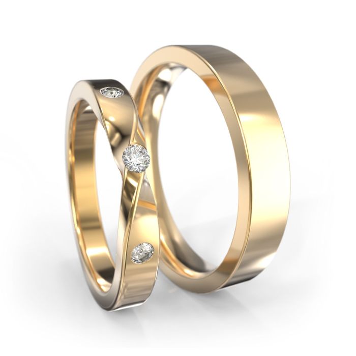 Обручальные кольца из белого золота с символом бесконечности в женском кольце