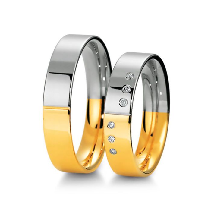 Оригинальные обручальные кольца из белого и желтого золота с бриллиантами