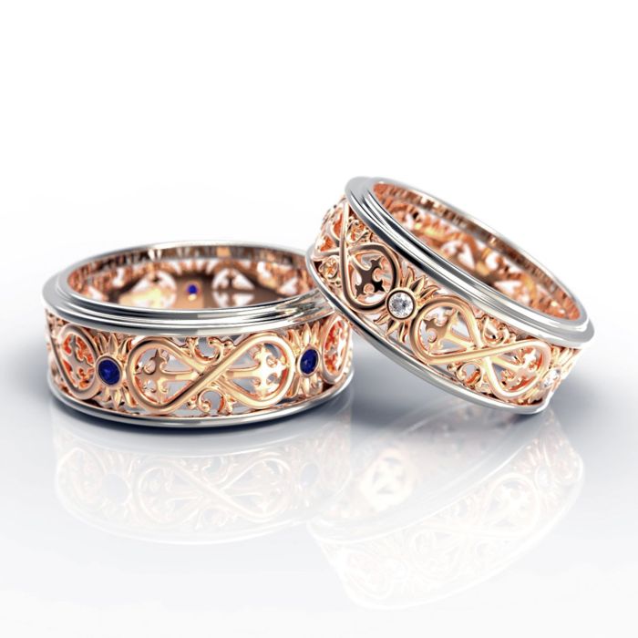 Обручальные кольца «Бесконечность» из комбинированного золота с бриллиантами и сапфирами
