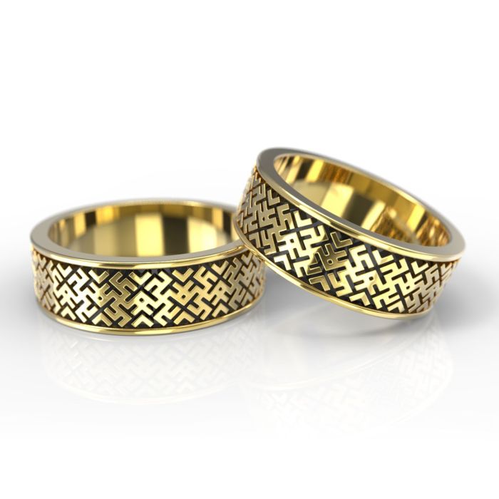 Обручальные кольца с символикой из красного золота и чернением