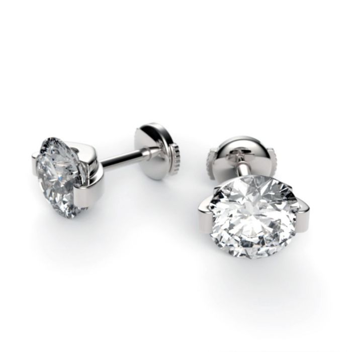 Серьги-гвоздики из белого золота с бриллиантом в оригинальной оправе