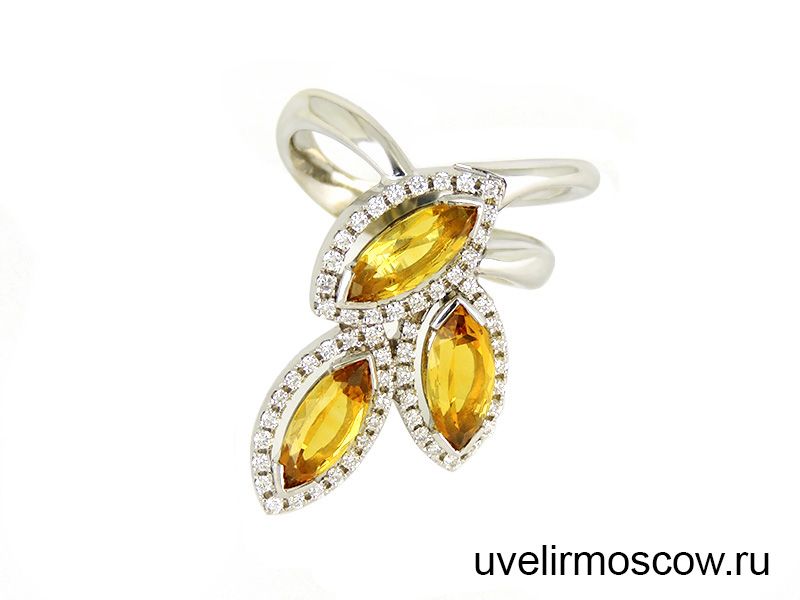 Женское кольцо из белого золота с топазами и бриллиантами