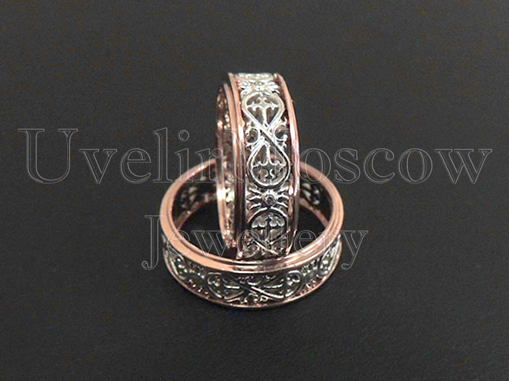 Обручальные кольца из комбинированного золота с узором «Бесконечность»