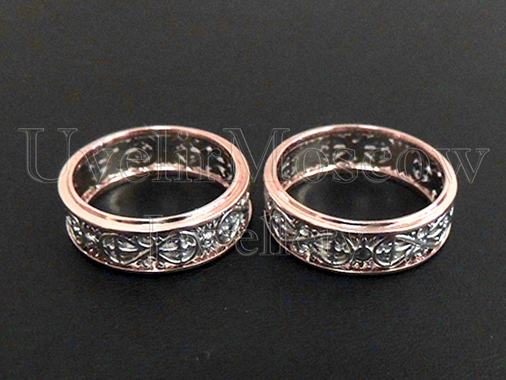 Обручальные кольца из комбинированного золота с узором «Бесконечность»