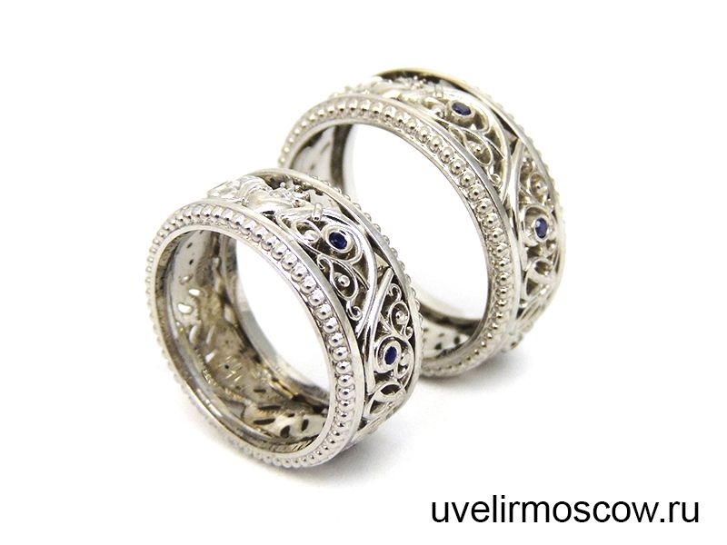 Парные обручальные кольца из белого золота с сапфирами